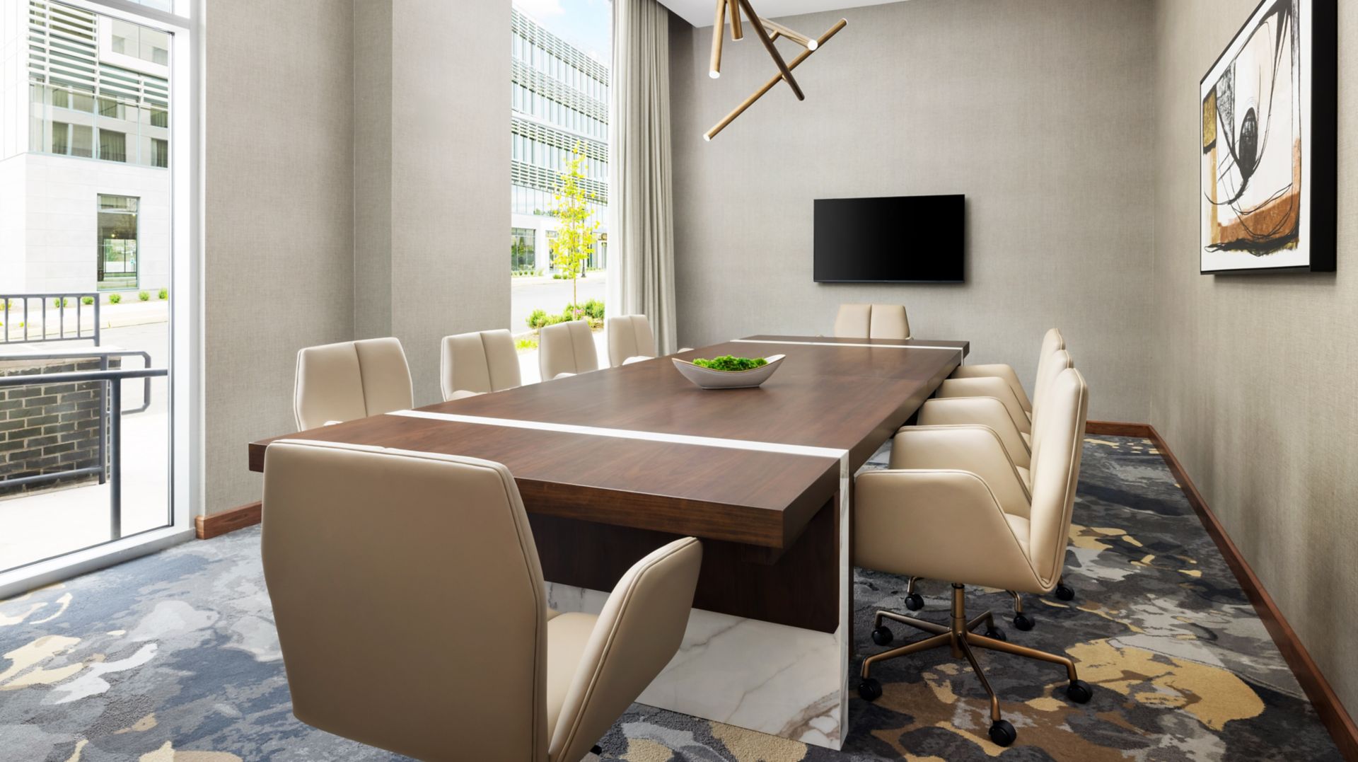 AC Hotel Newtown Square boardroom with a conference table and screen